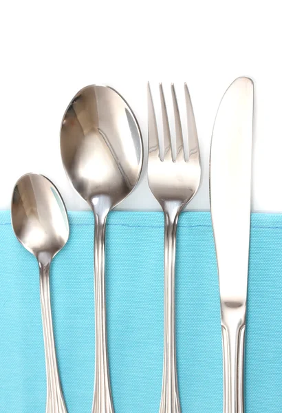 在蓝色桌布上的刀和叉、 勺子 — 图库照片