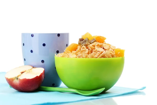 Tasty cornflakes in green bowl, apple and glass of milk isolated on white — Stock Photo, Image