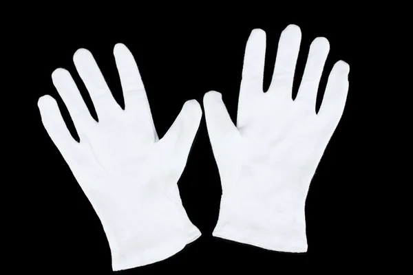 Тканинні рукавички на чорному тлі — стокове фото