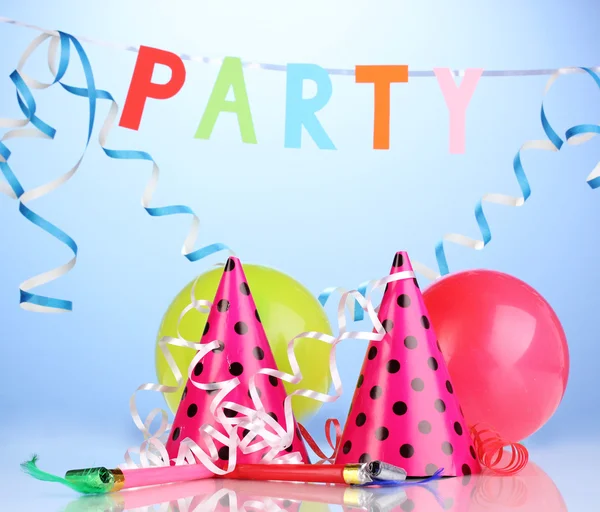 Party items on blue background — Stock Photo, Image