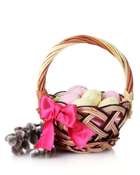 Basket with Easter eggs and pussy-willow twigs isolated on white — Stockfoto
