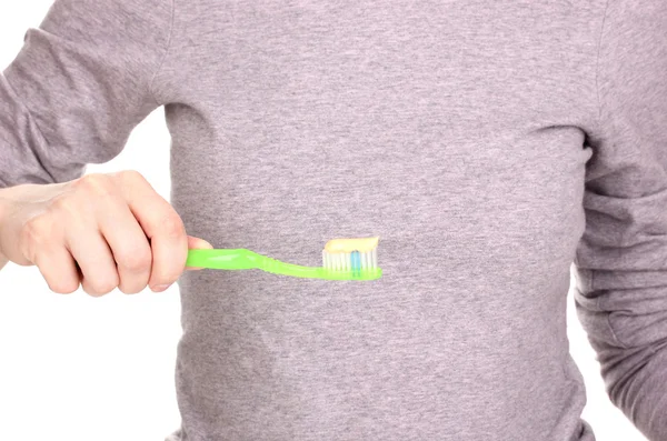 Tandenborstel met plakken in de hand geïsoleerd op wit — Stockfoto