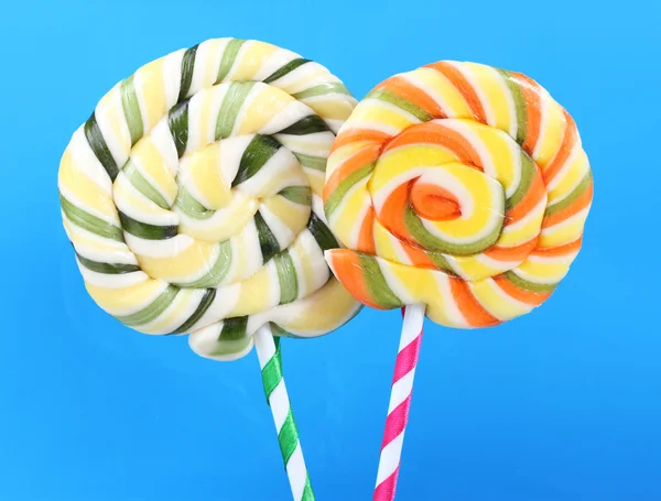 Colorful lollipops on blue background — Stock Photo, Image