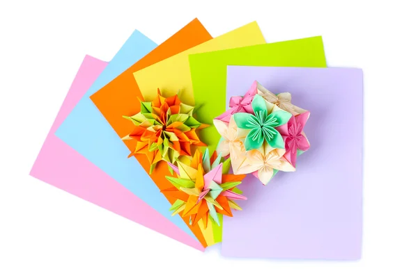 Colorfull origami kusudamas and bright paper isolated on white — Stock Photo, Image