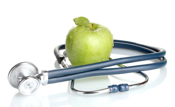 Medicinsk stetoskop och grönt äpple isolerad på vit — Stockfoto