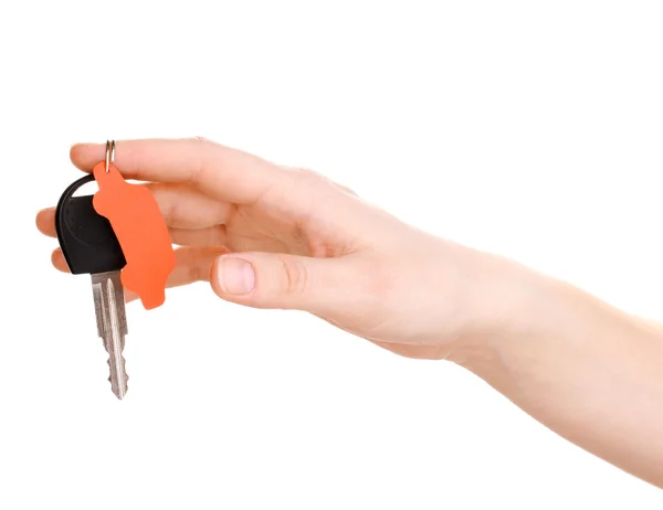 Klíč od auta s šarmem v ruce izolovaných na bílém — Stock fotografie