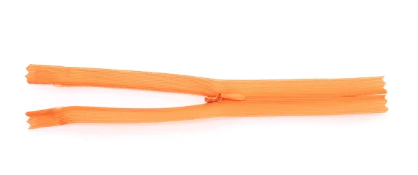 Orangefarbener Reißverschluss isoliert auf weiß — Stockfoto
