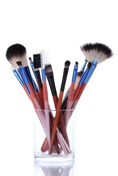 Make-up brushes in glass cup isolated on white — Stock Photo, Image