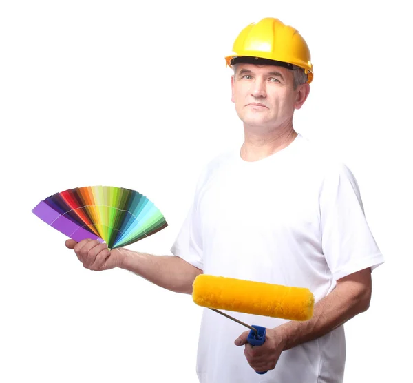 Painter holds a palette and roller isolated on white — Stock Photo, Image
