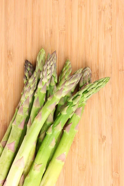 Delicious asparagus on wooden background — Stock Photo, Image