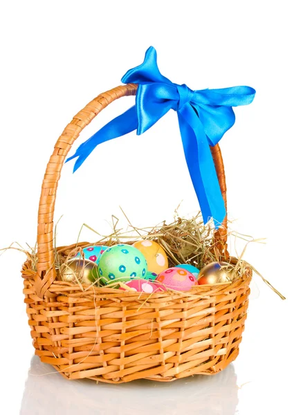 Colorful Easter eggs in the basket with a blue bow isolated on white — Stock Photo, Image