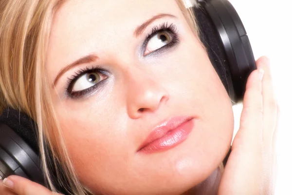 Woman with headphones listening to music isolated white backgrou — Stock Photo, Image