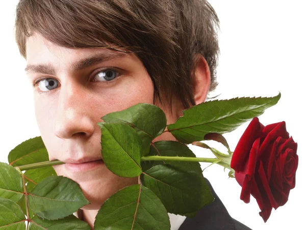 Młody człowiek, kwiat, czerwona róża na białym tle — Zdjęcie stockowe