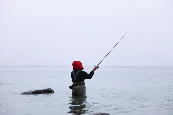 Fisherman in sea water autumn — Stock Photo, Image