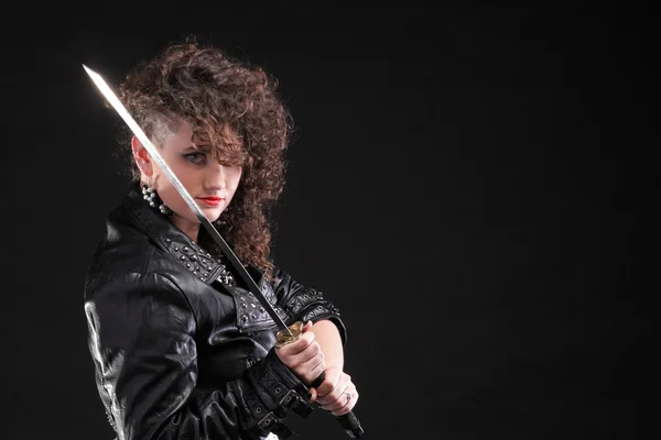 Piercing woman curly girl and sword — Stock Photo, Image