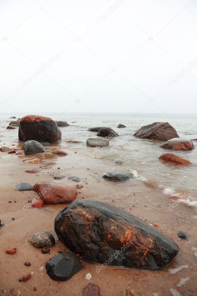 Stones in sea water autumn