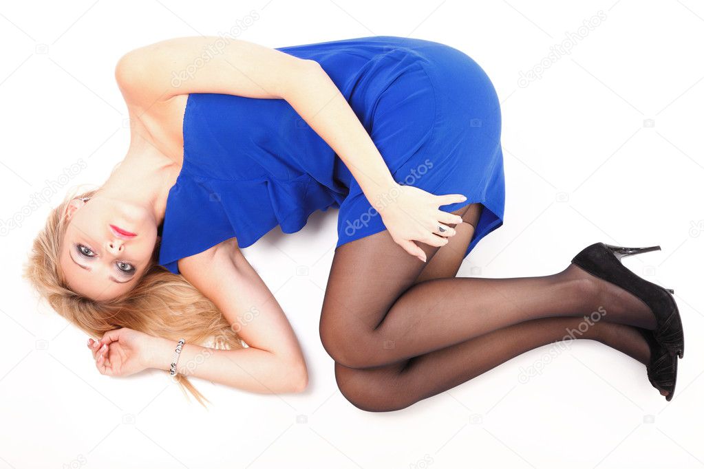 Woman lying lovely girl in blue dress over white