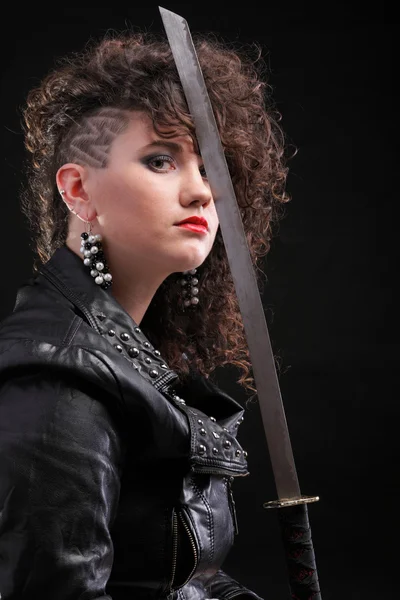 stock image Piercing woman curly girl and sword