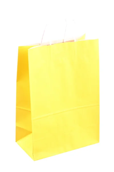 Compras bolsas de regalo amarillas y manzana aislada —  Fotos de Stock