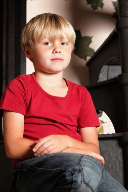 Boy sitting on stairs clipart