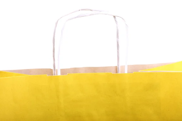 Einkaufen gelbe Geschenktüten und Apfel isoliert — Stockfoto