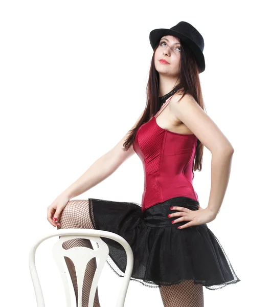 游龙戏凤女子舞蹈在红色紧身胸衣椅子白色隔离 — 图库照片