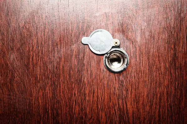Peephole on wooden door — Stock Photo, Image