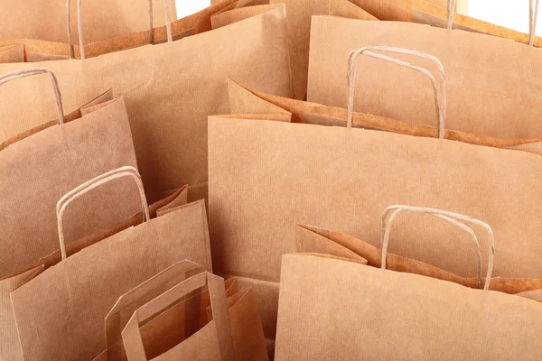 Compras sacos de presente marrom fundo — Fotografia de Stock
