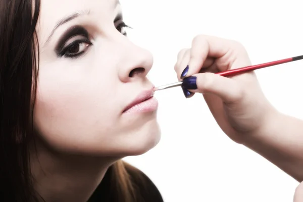 Beautiful young woman applying lips make-up zone — Stock Photo, Image