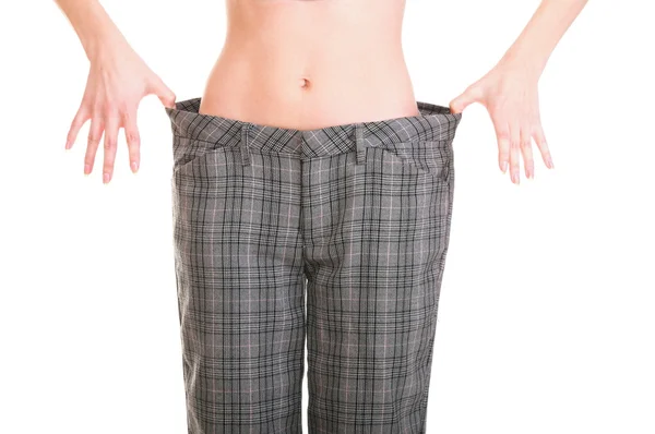 Woman showing how much weight she lost — Stock Photo, Image