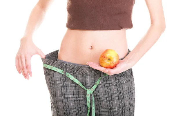 Mujer mostrando cuánto peso perdió — Foto de Stock