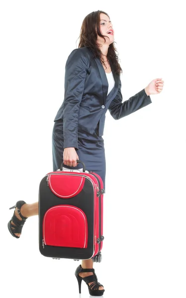 Full length young business woman to late red travel bagd — Stock Photo, Image