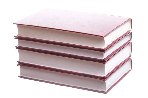 Na białym tle czerwony stos książek — Zdjęcie stockowe