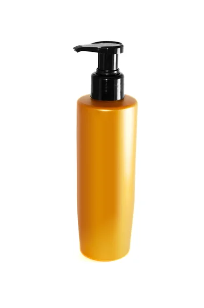 Bottiglia di shampoo giallo su uno sfondo bianco — Foto Stock