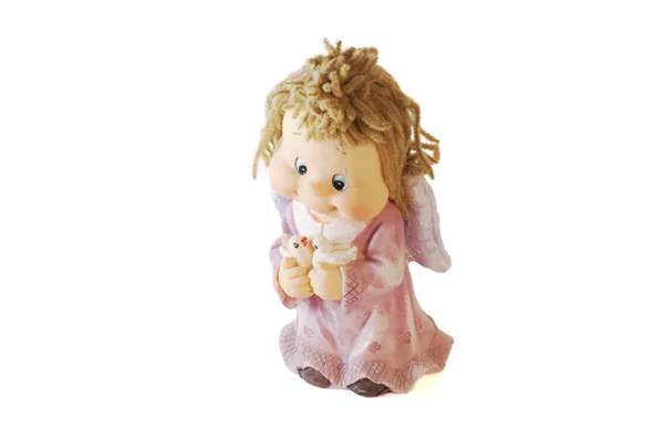 Άγγελος κούκλας πορσελάνης σε ένα ροζ φόρεμα Εικόνα Αρχείου