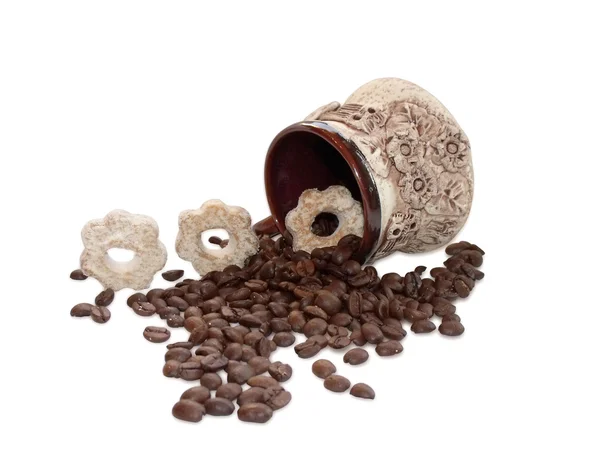 Cup with coffee beans and biscuits on a white background — Stock Photo, Image