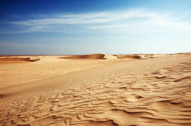 Sand dunes in Sahara clipart