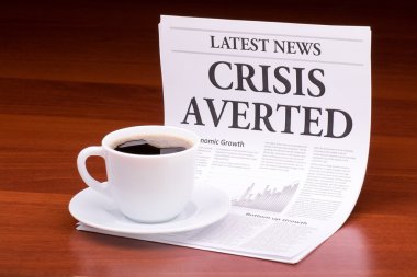 The newspaper LATEST NEWSwith the headline CRISIS AVERTED clipart