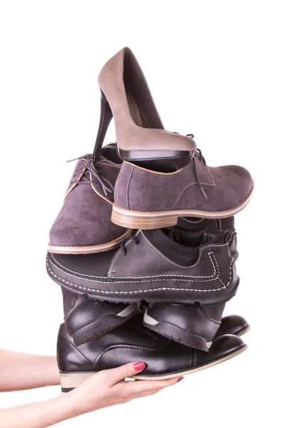 Birçok erkek ayakkabısı ve bir kadının ayakkabı — Stok fotoğraf