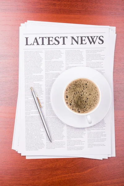 The newspaper LATEST NEWS on table and coffee — Stock Photo, Image