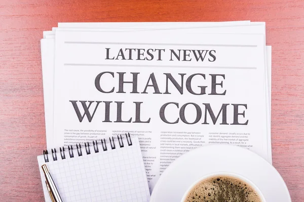 The newspaper CHANGE WILL Come and coffee — стоковое фото