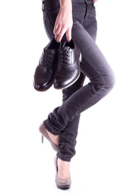 Woman holding a pair of men's shoes clipart