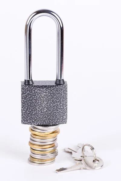 Open a padlock on a pile of coins — Stock Photo, Image