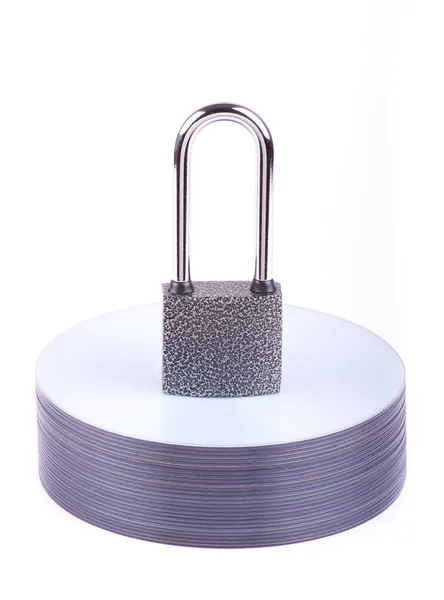 Padlock on the stack of CD — Stock Photo, Image