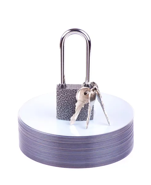 Padlock and key on the stack of CD — Stock Photo, Image