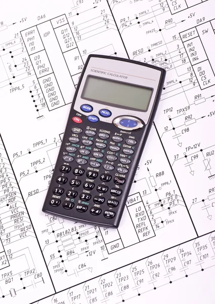 Calculator on the drawing electrical circuit — Stock Photo, Image
