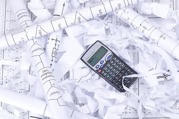 Calculator and waste paper — Stock Photo, Image