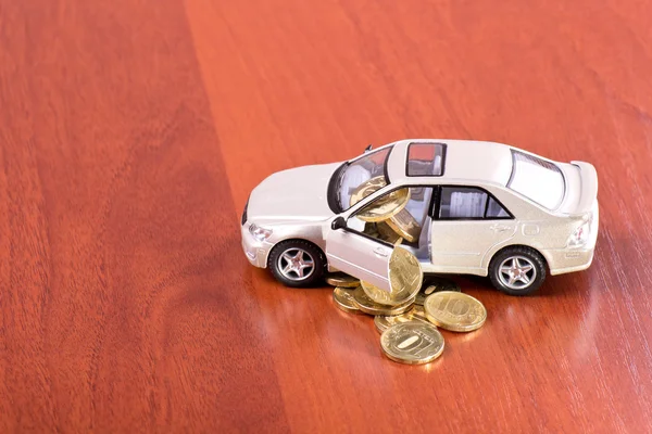 Coins fall out of the car — Stock Photo, Image