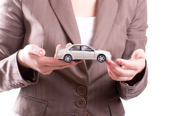 Hands and model of car — Stock Photo, Image