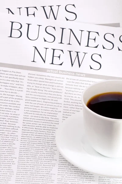 Business newspaper and cup of coffee — Stock Photo, Image
